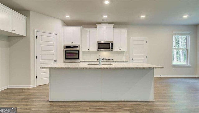 165 Cooper Cv E, Fayetteville, GA 30215 - kitchen featuring appliances with stainless steel finishes, a sink, baseboards, dark wood-style flooring, and recessed lighting