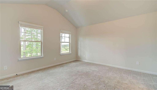 165 Cooper Cv E, Fayetteville, GA 30215 - unfurnished room featuring lofted ceiling, carpet floors, and baseboards