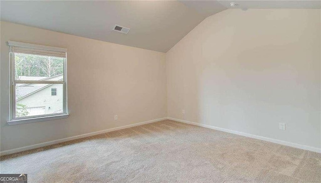 165 Cooper Cv E, Fayetteville, GA 30215 - carpeted spare room featuring vaulted ceiling and baseboards