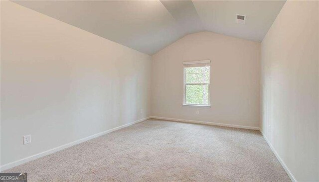 165 Cooper Cv E, Fayetteville, GA 30215 - bonus room featuring light carpet, lofted ceiling, and baseboards