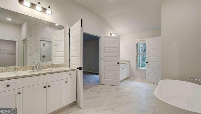 165 Cooper Cv E, Fayetteville, GA 30215 - bathroom with a marble finish shower, marble finish flooring, vanity, a soaking tub, and lofted ceiling