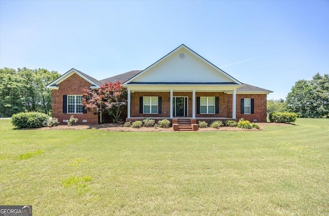 737 Raleigh Cobb Rd, Hawkinsville, GA 31036 - view of front facade featuring covered porch, a front yard, and brick siding