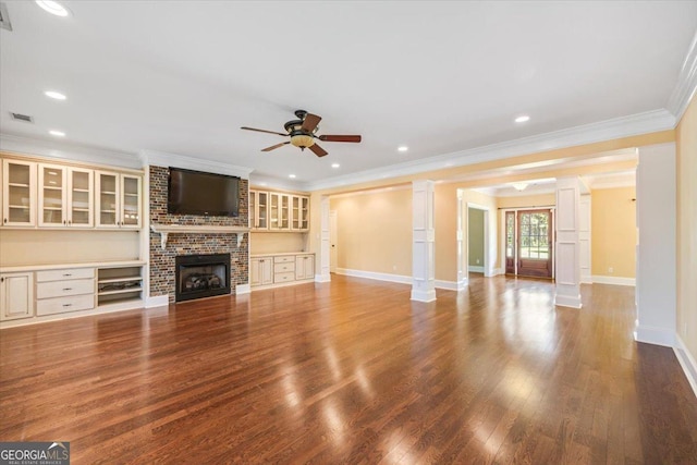 737 Raleigh Cobb Rd, Hawkinsville, GA 31036 - unfurnished living room featuring a ceiling fan, wood finished floors, decorative columns, ornamental molding, and baseboards