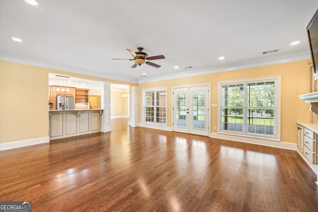 737 Raleigh Cobb Rd, Hawkinsville, GA 31036 - unfurnished living room featuring a ceiling fan, dark wood-type flooring, baseboards, crown molding, and french doors
