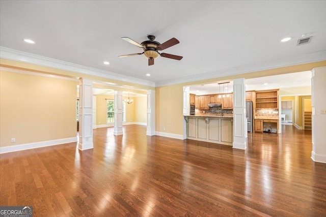 737 Raleigh Cobb Rd, Hawkinsville, GA 31036 - unfurnished living room with a ceiling fan, ornamental molding, wood finished floors, recessed lighting, and baseboards