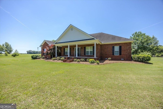 737 Raleigh Cobb Rd, Hawkinsville, GA 31036 - greek revival inspired property with a porch, a front lawn, brick siding, and a shingled roof