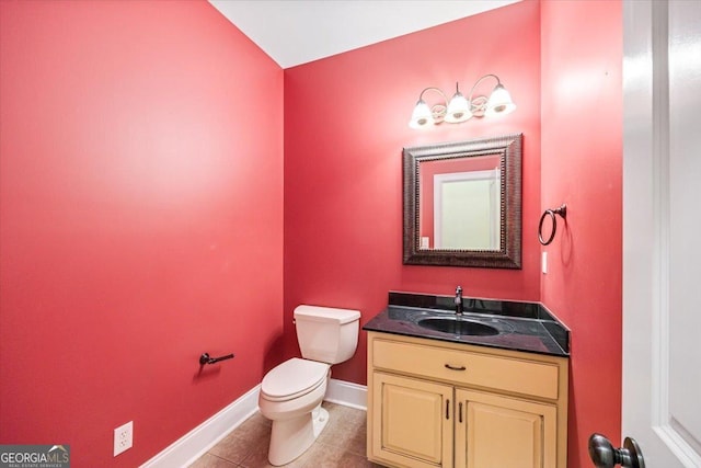 737 Raleigh Cobb Rd, Hawkinsville, GA 31036 - bathroom featuring toilet, vanity, baseboards, and tile patterned floors