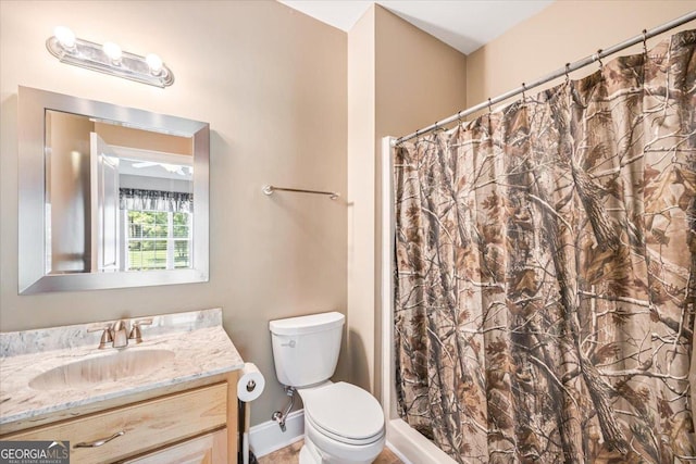 737 Raleigh Cobb Rd, Hawkinsville, GA 31036 - full bathroom featuring vanity, toilet, curtained shower, and baseboards