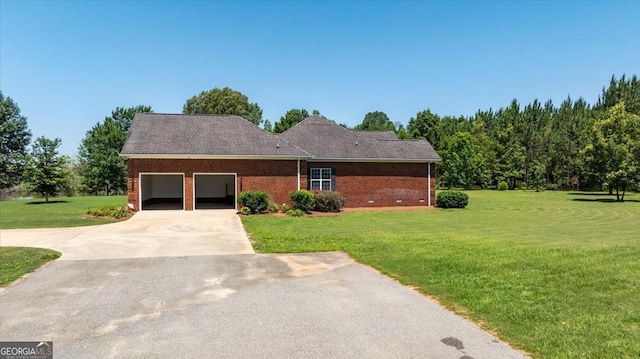 737 Raleigh Cobb Rd, Hawkinsville, GA 31036 - ranch-style house featuring an attached garage, a front lawn, driveway, and brick siding