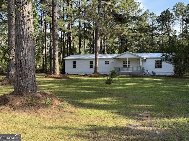 12103 US Highway 80 E, Brooklet, GA 30415 - view of front of house featuring a front lawn, covered porch, and metal roof