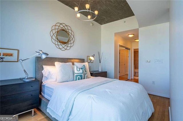 860 Peachtree St NE Unit 1613, Atlanta, GA 30308 - bedroom with wood finished floors and baseboards