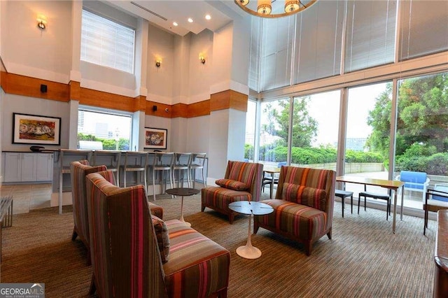 860 Peachtree St NE Unit 1613, Atlanta, GA 30308 - building lobby with a high ceiling and recessed lighting
