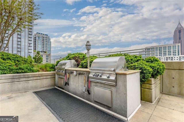 860 Peachtree St NE Unit 1613, Atlanta, GA 30308 - view of patio featuring area for grilling and a city view