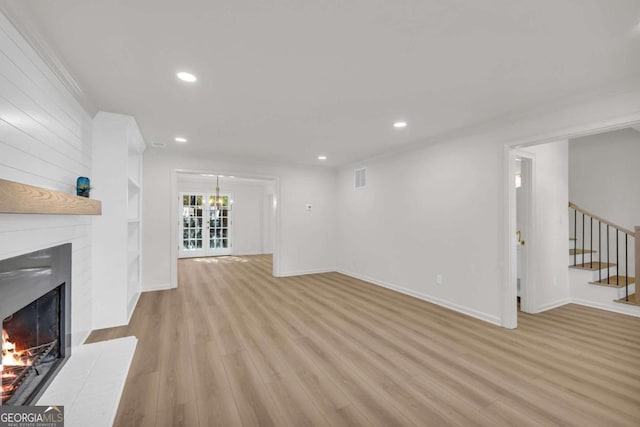 1 N Boundary Pl NW, Atlanta, GA 30318 - unfurnished living room featuring a fireplace, light wood finished floors, stairs, recessed lighting, and baseboards