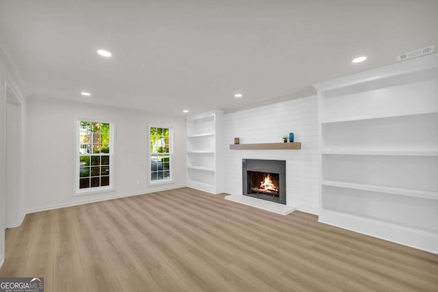 1 N Boundary Pl NW, Atlanta, GA 30318 - unfurnished living room featuring a brick fireplace, recessed lighting, wood finished floors, baseboards, and built in features