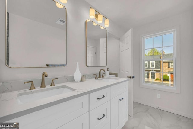 1 N Boundary Pl NW, Atlanta, GA 30318 - full bathroom featuring marble look tiles, double vanity, and baseboards