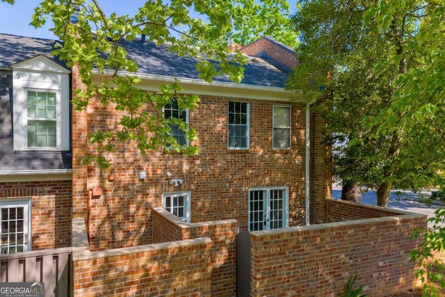 1 N Boundary Pl NW, Atlanta, GA 30318 - view of side of home with brick siding and a shingled roof