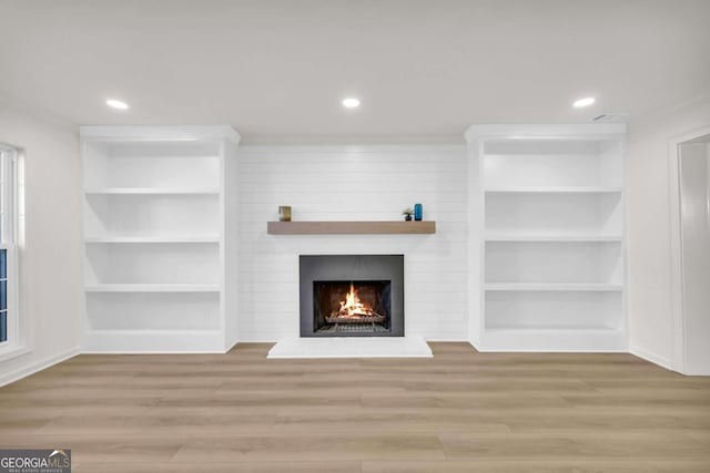 1 N Boundary Pl NW, Atlanta, GA 30318 - unfurnished living room with a fireplace, wood finished floors, recessed lighting, built in shelves, and baseboards