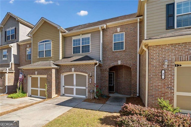 100 Trailside Way, Hiram, GA 30141 - view of property featuring concrete driveway, brick siding, and a garage