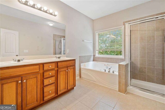 100 Trailside Way, Hiram, GA 30141 - full bath featuring a bath, a stall shower, double vanity, and tile patterned floors