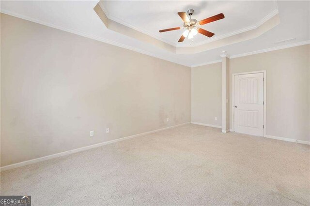 100 Trailside Way, Hiram, GA 30141 - carpeted empty room with a tray ceiling, a ceiling fan, ornamental molding, and baseboards