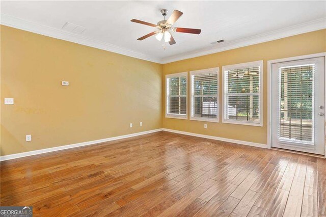 100 Trailside Way, Hiram, GA 30141 - spare room with wood finished floors, baseboards, a ceiling fan, and crown molding