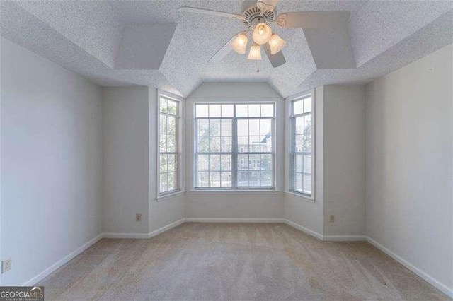 1015 Mcgill Park Ave NE, Atlanta, GA 30312 - unfurnished room with a ceiling fan, carpet, a textured ceiling, baseboards, and vaulted ceiling
