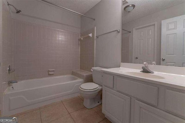 1015 Mcgill Park Ave NE, Atlanta, GA 30312 - full bathroom featuring tile patterned flooring, tub / shower combination, a textured ceiling, toilet, and vanity