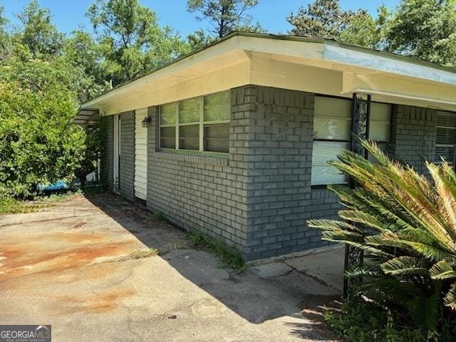 306 Greenview St, Jesup, GA 31545 - view of side of home featuring brick siding