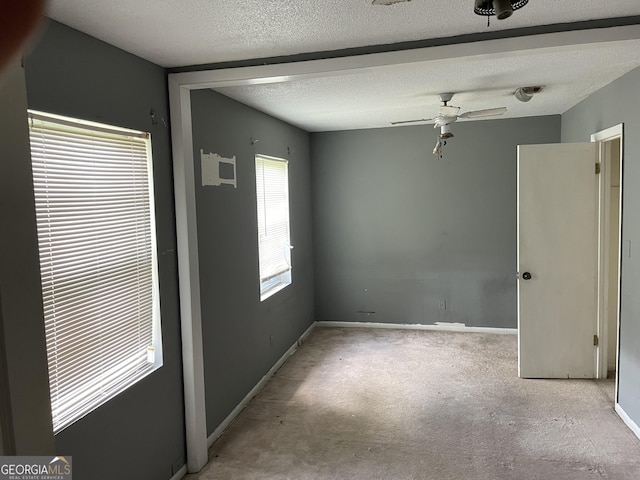 306 Greenview St, Jesup, GA 31545 - empty room with a ceiling fan, baseboards, carpet floors, and a textured ceiling