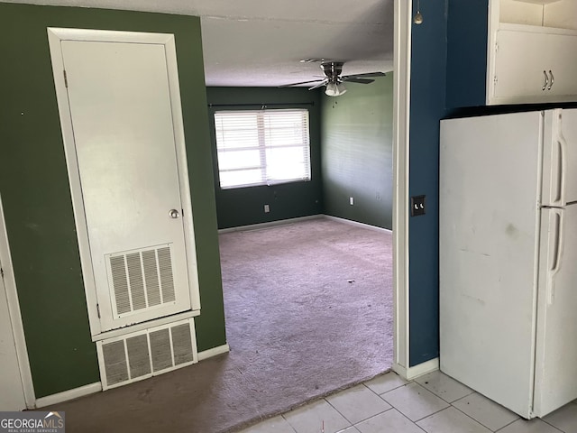 306 Greenview St, Jesup, GA 31545 - unfurnished room with light carpet, a ceiling fan, baseboards, and light tile patterned flooring