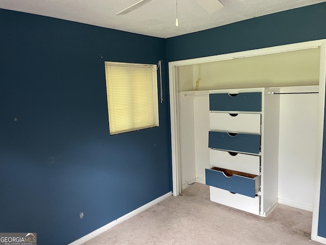 306 Greenview St, Jesup, GA 31545 - unfurnished bedroom featuring carpet flooring, a closet, baseboards, and ceiling fan