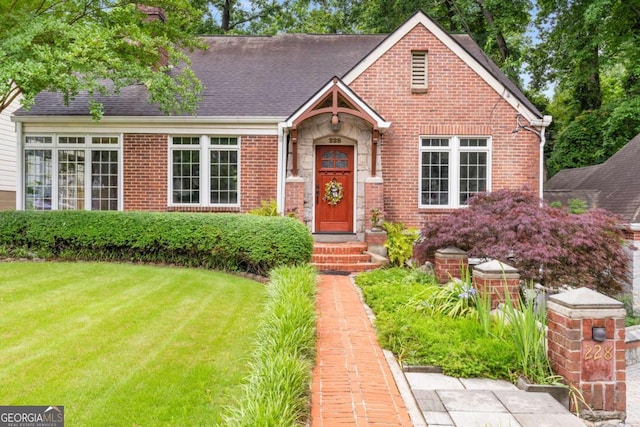 228 Clarion Ave, Decatur, GA 30030 - view of front of property with a front lawn, brick siding, stone siding, and a shingled roof