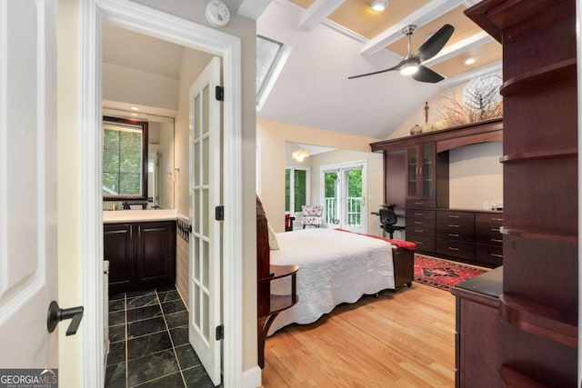 228 Clarion Ave, Decatur, GA 30030 - bedroom featuring lofted ceiling, french doors, dark wood-style flooring, connected bathroom, and ceiling fan