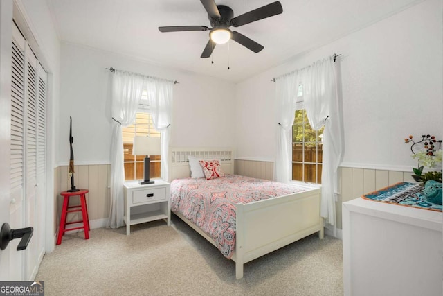 228 Clarion Ave, Decatur, GA 30030 - carpeted bedroom featuring a wainscoted wall, multiple windows, and ceiling fan