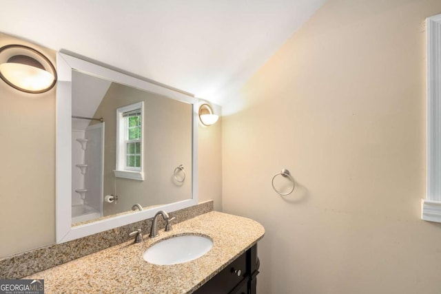 228 Clarion Ave, Decatur, GA 30030 - bathroom featuring vaulted ceiling and vanity