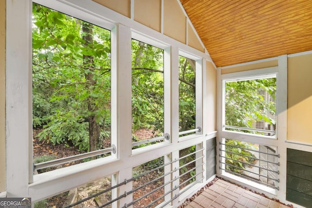 228 Clarion Ave, Decatur, GA 30030 - unfurnished sunroom featuring wooden ceiling, vaulted ceiling, and brick patterned flooring