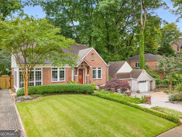228 Clarion Ave, Decatur, GA 30030 - view of front facade with brick siding, a garage, and concrete driveway