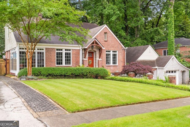 228 Clarion Ave, Decatur, GA 30030 - view of front of home featuring brick siding, a front yard, and roof with shingles