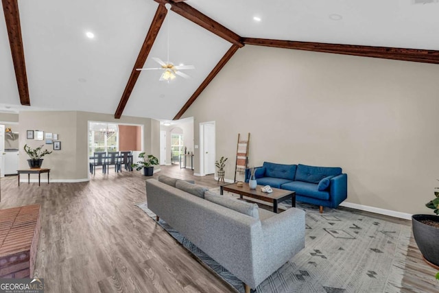 502 Stoneland Pl, Lawrenceville, GA 30046 - living room with high vaulted ceiling, beam ceiling, wood finished floors, and ceiling fan