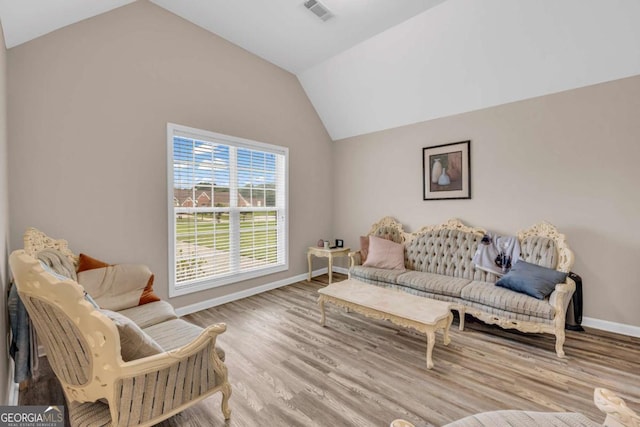 502 Stoneland Pl, Lawrenceville, GA 30046 - living room featuring vaulted ceiling and wood finished floors