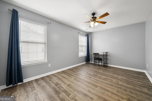 1535 Fenmore St, Lithia Springs, GA 30122 - empty room featuring ceiling fan and wood finished floors