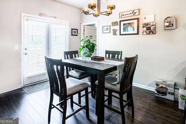 174 Silver Birch Pass, Newnan, GA 30265 - dining area with dark wood finished floors, a chandelier, and baseboards