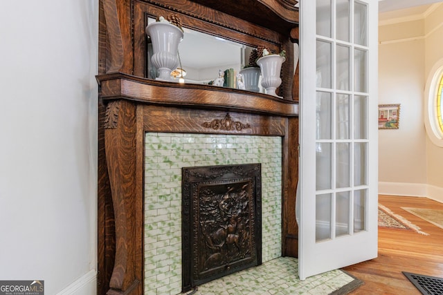 381 Cherokee Ave SE, Atlanta, GA 30312 - detailed view of wood finished floors, crown molding, and a fireplace