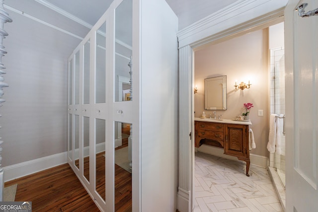 381 Cherokee Ave SE, Atlanta, GA 30312 - bathroom featuring vanity, wood finished floors, and crown molding