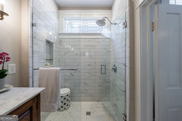 381 Cherokee Ave SE, Atlanta, GA 30312 - bathroom featuring a shower stall, vanity, and tile patterned floors