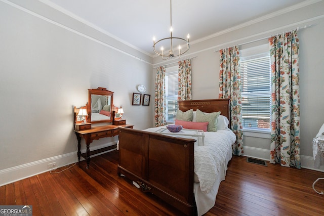 381 Cherokee Ave SE, Atlanta, GA 30312 - bedroom with hardwood / wood-style flooring, a chandelier, multiple windows, crown molding, and a desk