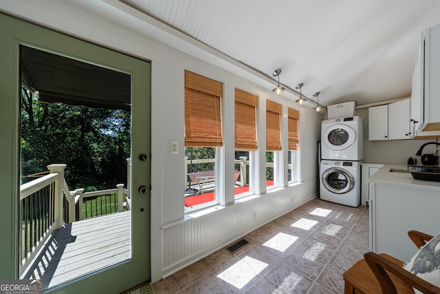 381 Cherokee Ave SE, Atlanta, GA 30312 - washroom featuring stacked washer and clothes dryer