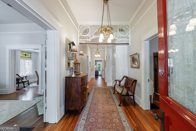 381 Cherokee Ave SE, Atlanta, GA 30312 - entryway featuring a chandelier, wood finished floors, crown molding, and arched walkways