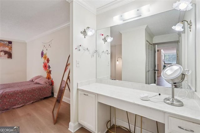 3530 Piedmont Rd NE Unit 2I, Atlanta, GA 30305 - bathroom with wood finished floors, ornamental molding, and vanity